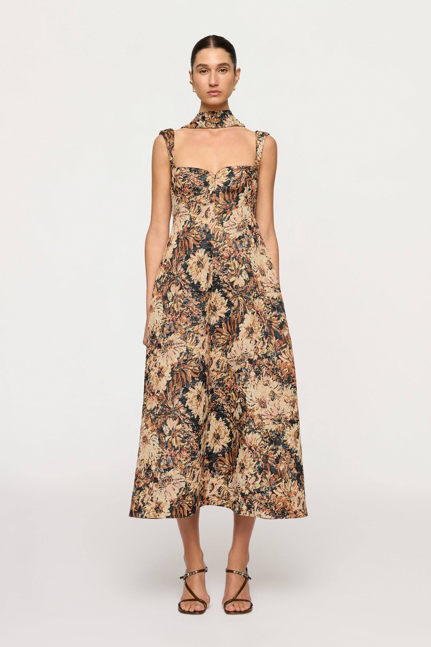 Woman wearing a floral dress on a white background