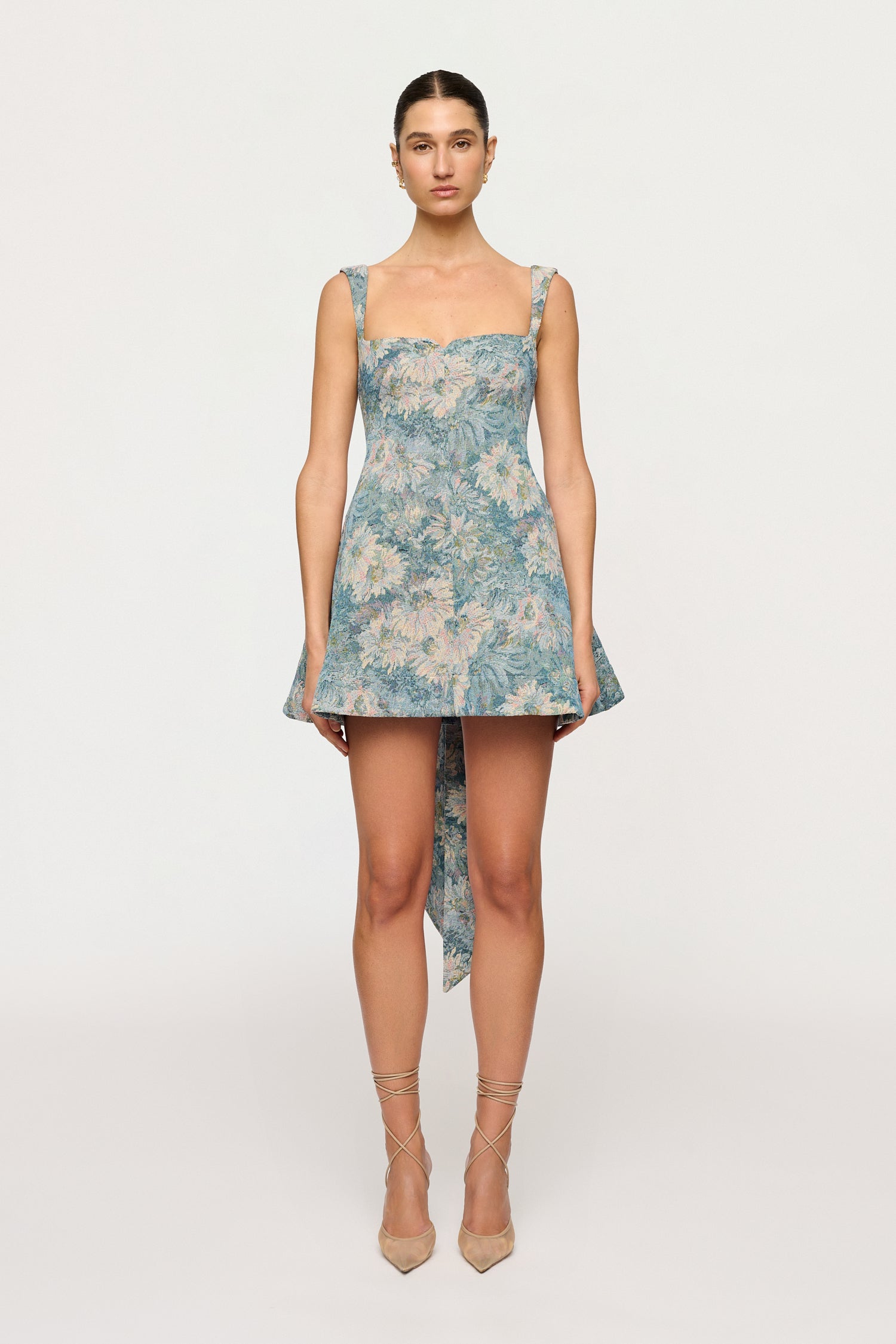 Woman wearing a floral dress on a white background