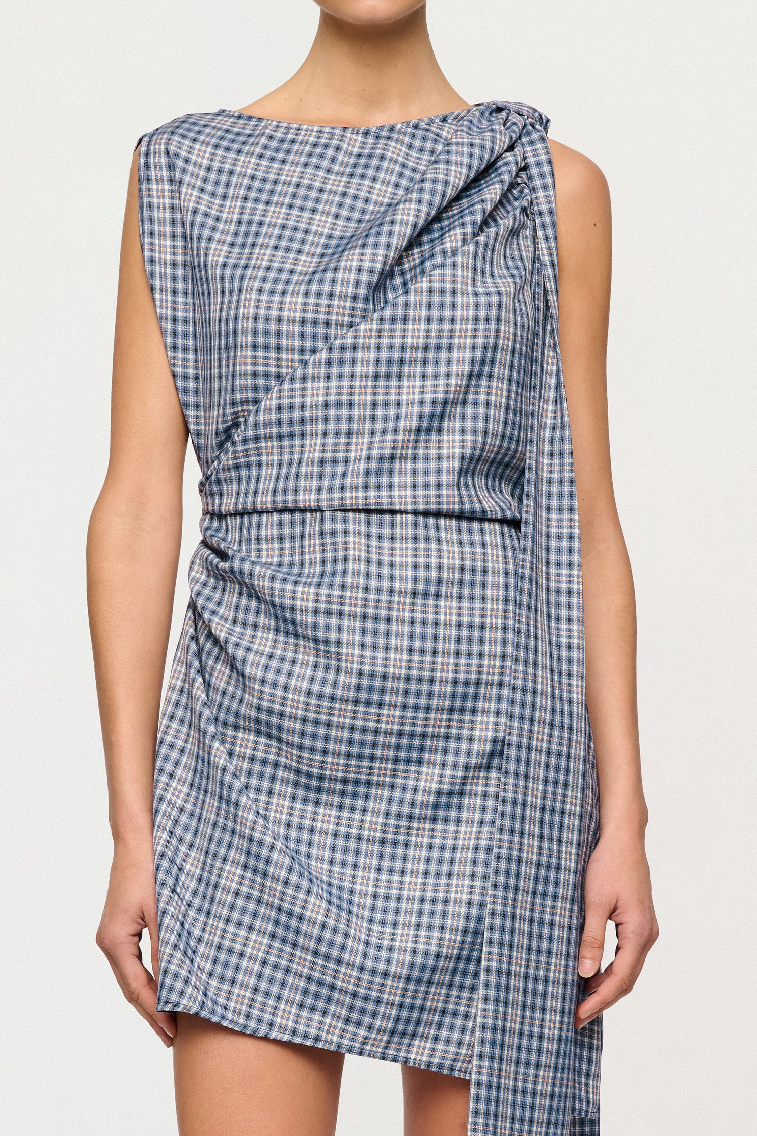 Blue and white checkered dress on a plain background